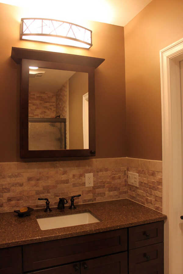 Deep Earth Tones on Wall to Enhance Guest Bathroom